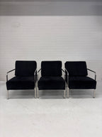 Design fauteuil zwarte stof met chromen frame