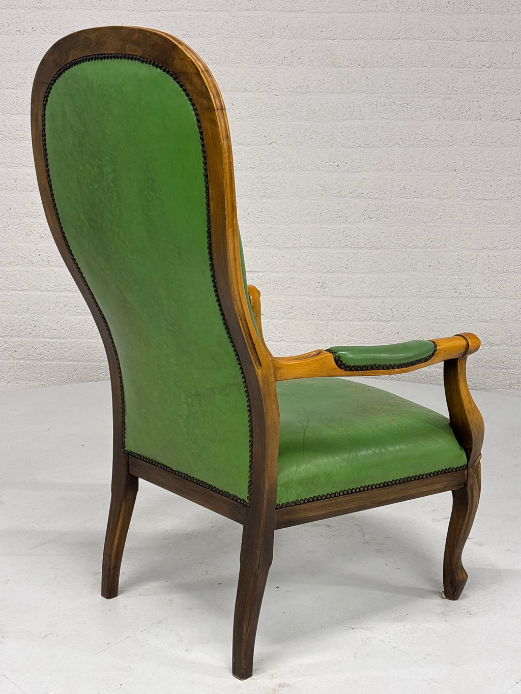 Fauteuil gecapitonneerd met lederlook
