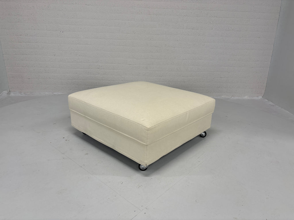 Hocker stof creme op wielen