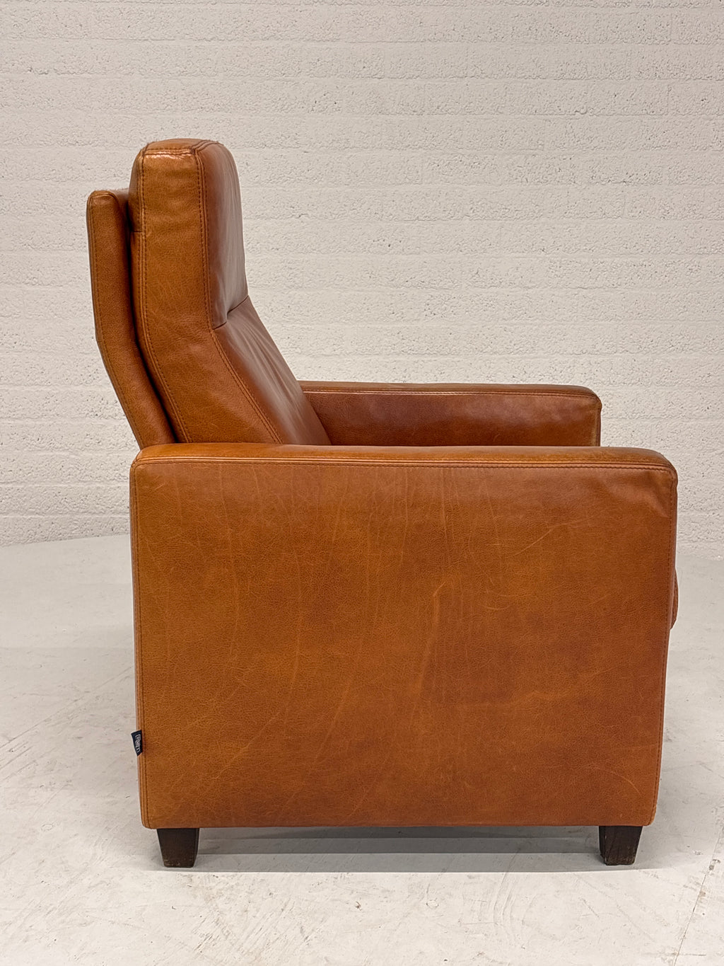 Leren fauteuil vaste rugleuning