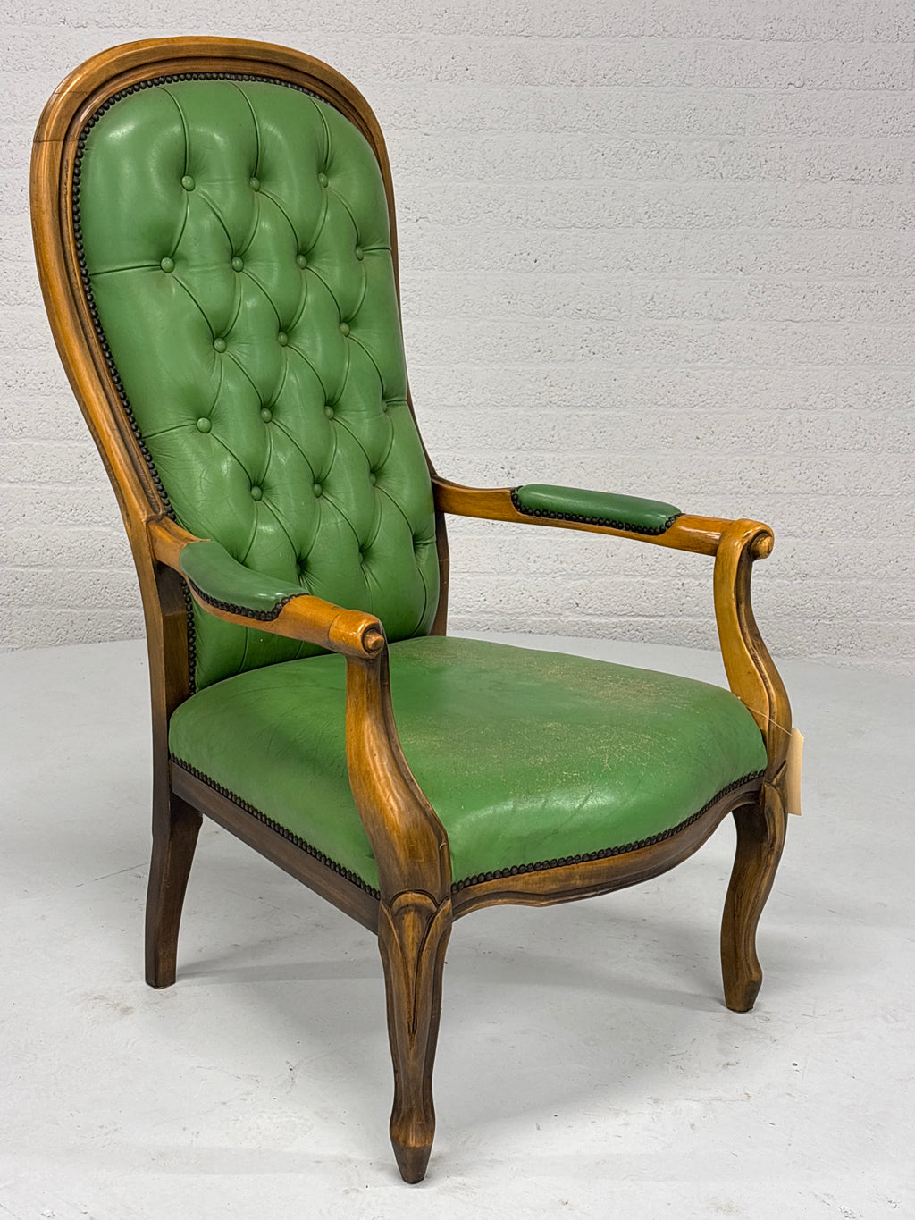 Fauteuil gecapitonneerd met lederlook