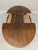 Ovale eiken eettafel met klapbladen
