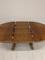 Ovale eiken eettafel met klapbladen