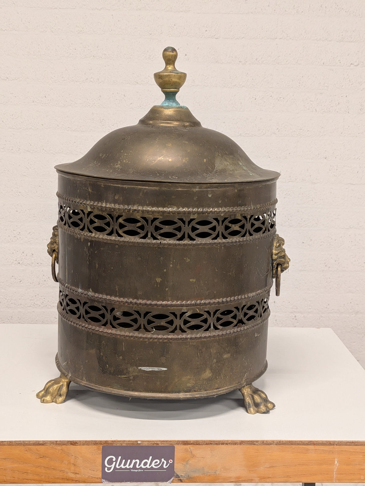Koperen kolenkit met leeuwenkoppen