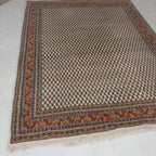 Perzisch tapijt in rood/beige tinten