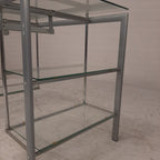 Glazen bureau op buizenframe