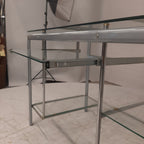 Glazen bureau op buizenframe