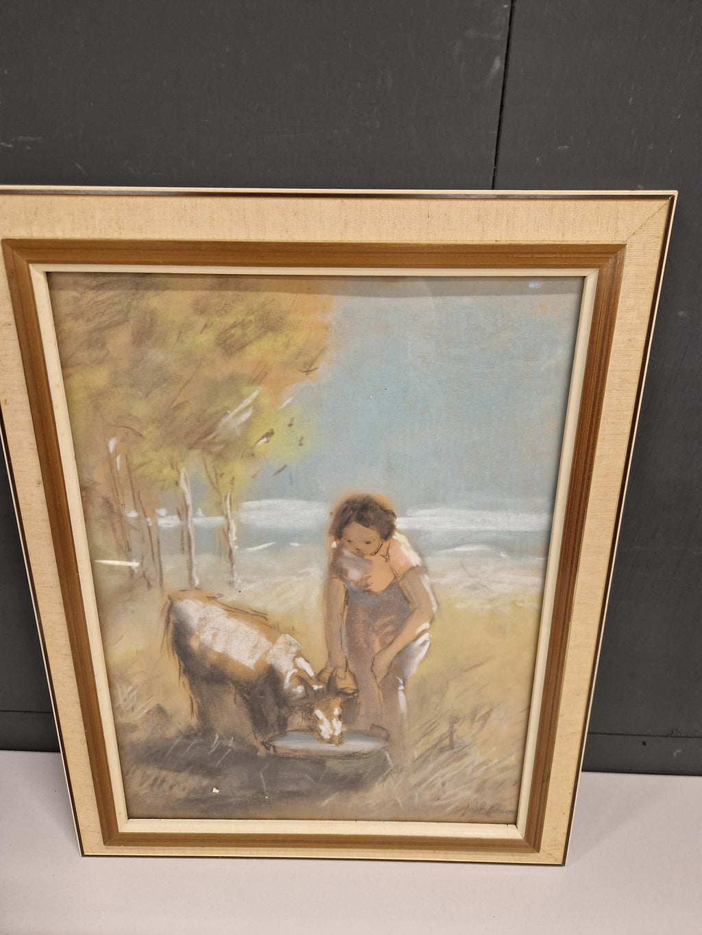 Gesigneerde pastel, vrouw bij geitje