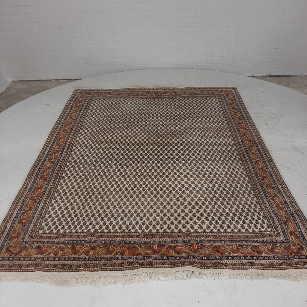 Perzisch tapijt in rood/beige tinten
