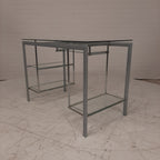 Glazen bureau op buizenframe